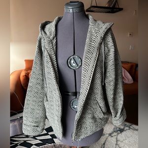 Heavy wool zip up hoodie. Extremely warm, and extremely well made. Very unique.